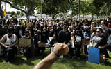 In this June 1, 2020, file photo, demonstrators raise their fists during a protest over the death of George Floyd in Anaheim, Calif.  (AP Photo/Jae C. Hong, File)