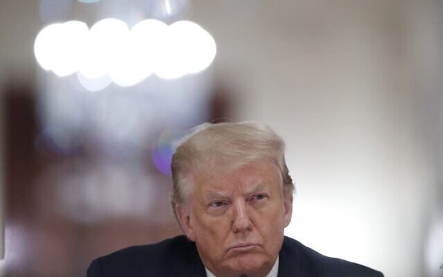 US President Donald Trump listens during a "National Dialogue on Safely Reopening America's Schools" event in the East Room of the White House, on July 7, 2020 (AP Photo/Alex Brandon) US President Donald Trump listens during a "National Dialogue on Safely Reopening America's Schools" event in the East Room of the White House, on July 7, 2020 (AP Photo/Alex Brandon)