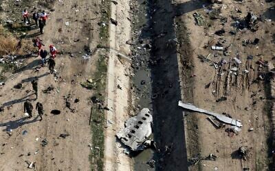 Rescue workers search the scene where a Ukrainian plane crashed in Shahedshahr, southwest of Tehran, Iran, on January 8, 2020. (AP Photo/Ebrahim Noroozi, File)
