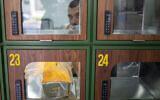 A ready to take away Go Noodles box is placed in a glass-paned locker in Tel Aviv, on July 16, 2020. (Ariel Schalit/AP)