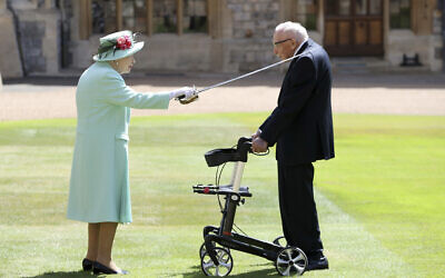 Captain Sir Thomas Moore receives his knighthood from Britain's Queen Elizabeth, during a ceremony at Windsor Castle in Windsor, England, Friday, July 17, 2020 (Chris Jackson/Pool Photo via AP)