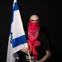Dekel Gilag, 25, poses for a photo during a protest against Prime Minister Benjamin Netanyahu, outside his residence in Jerusalem, July 23, 2020. (AP Photo/Oded Balilty) Dekel Gilag, 25, poses for a photo during a protest against Prime Minister Benjamin Netanyahu, outside his residence in Jerusalem, July 23, 2020. (AP Photo/Oded Balilty)