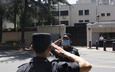 Chinese SWAT officers salute each other at the former United States Consulate in Chengdu in southwest China's Sichuan province on July 27, 2020 (AP Photo/Ng Han Guan)
