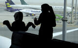 Illustrative: Passengers watch aircraft on the tarmac as they wait for their flight at the King Abdulaziz International Airport in Jeddah, Saudi Arabia, on July 28, 2020.  (AP/Amr Nabil)
