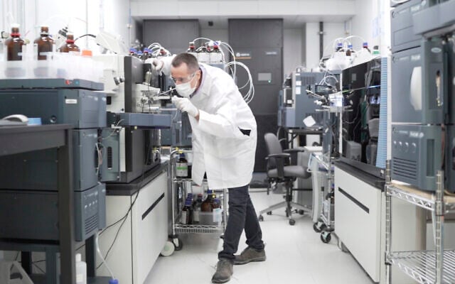 In this image from video provided by Washington University, researcher Nicolas Barthelemy works on a p-tau217 test for Alzheimer's disease at a laboratory in St. Louis, Missouri on July 27, 2020. (Huy Mach/Washington University, St. Louis via AP) In this image from video provided by Washington University, researcher Nicolas Barthelemy works on a p-tau217 test for Alzheimer's disease at a laboratory in St. Louis, Missouri on July 27, 2020. (Huy Mach/Washington University, St. Louis via AP)