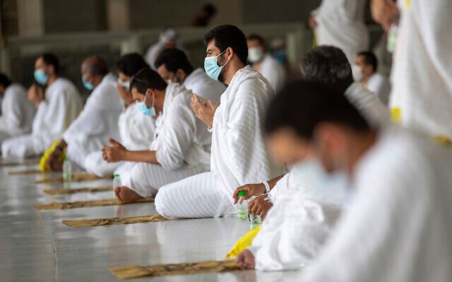 A limited numbers of pilgrims pray in the first rituals of the hajj, as they keep social distancing to limit exposure and the potential transmission of the coronavirus, at the Grand Mosque in the Muslim holy city of Mecca, Saudi Arabia, July 29, 2020. (Saudi Media Ministry via AP) A limited numbers of pilgrims pray in the first rituals of the hajj, as they keep social distancing to limit exposure and the potential transmission of the coronavirus, at the Grand Mosque in the Muslim holy city of Mecca, Saudi Arabia, July 29, 2020. (Saudi Media Ministry via AP)