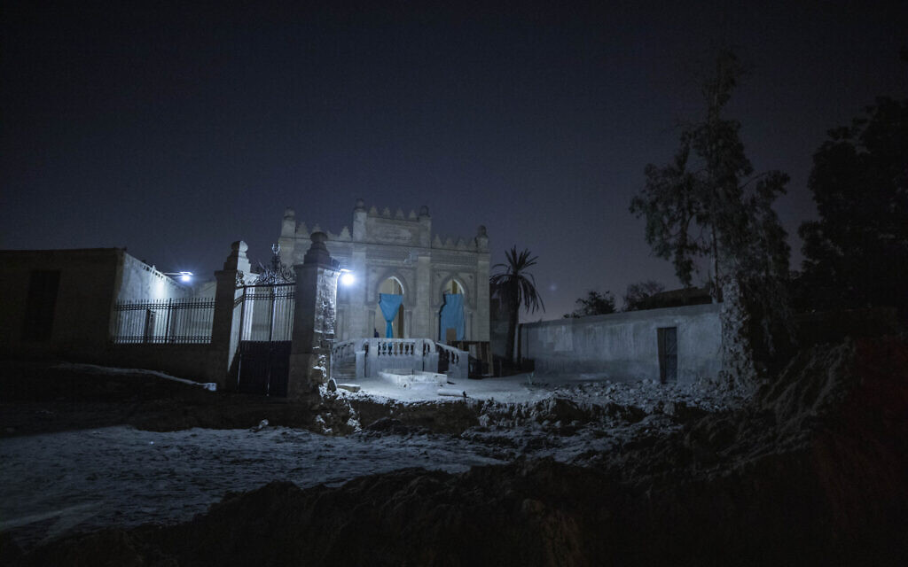 A tomb from the early 20th Century stands partially demolished amid construction of a new highway through the Northern Cemetery in Cairo, Egypt, Sunday, July 26, 2020. (AP Photo/Nariman El-Mofty)