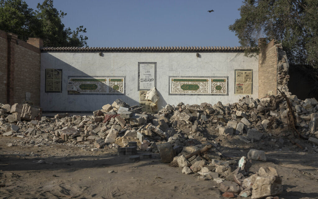 A family grave stands exposed after its walls were knocked down as part of construction of a new highway through the Northern Cemetery, part of the City of the Dead, a UNESCO World Heritage site, in Cairo, Egypt, Tuesday, July 21, 2020.  (AP Photo/Nariman El-Mofty)
