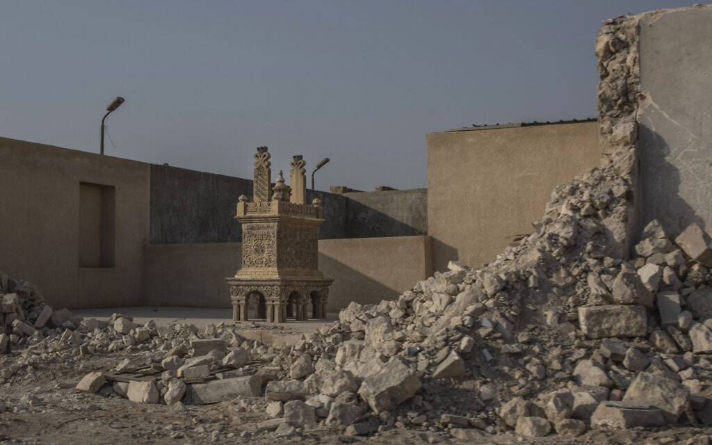 A tomb stands exposed after its walls were knocked down as part of construction of a new highway through the Northern Cemetery, part of the City of the Dead, a UNESCO World Heritage site, in Cairo, Egypt, Tuesday, July 28, 2020. (AP Photo/Nariman El-Mofty)