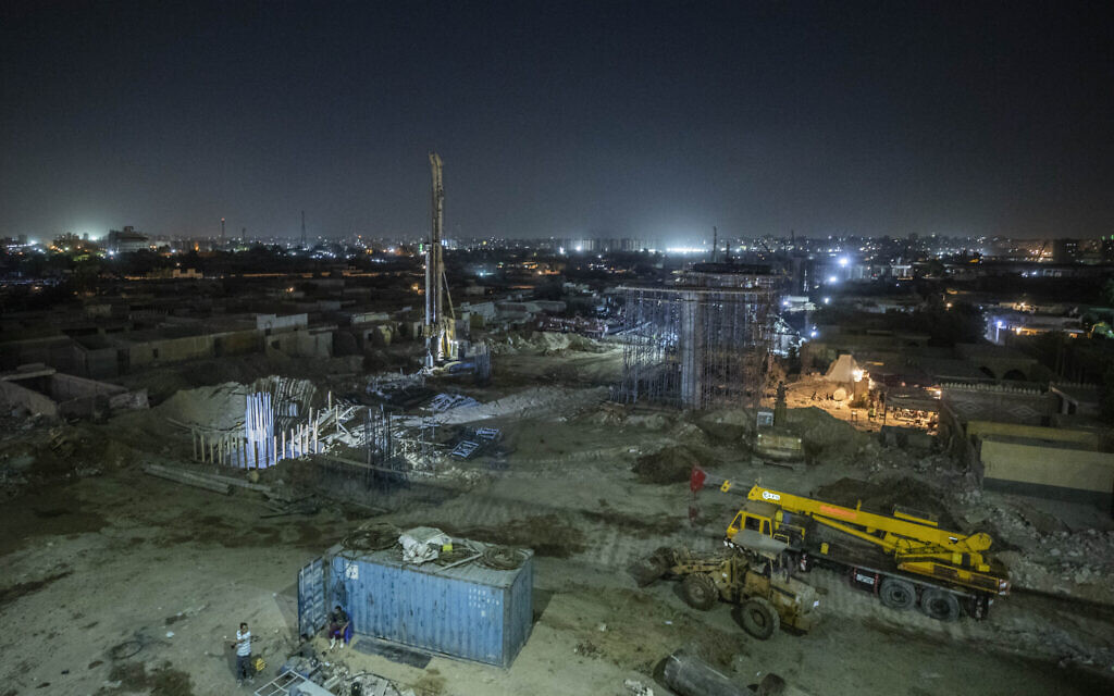Construction work on a highway flyover in a portion cleared of graves in the City of Dead in Cairo, Egypt, Sunday, July 26, 2020. (AP Photo/Nariman El-Mofty)