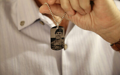 Brian McEnroe, the father of fallen US Green Beret Kevin McEnroe, displays a memorial dog tag depicting his fallen son, in Amman, Jordan, June 17, 2017. (Sam McNeil/AP)