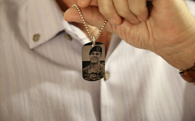 Brian McEnroe, the father of fallen US Green Beret Kevin McEnroe, displays a memorial dog tag depicting his fallen son, in Amman, Jordan, June 17, 2017. (Sam McNeil/AP) Brian McEnroe, the father of fallen US Green Beret Kevin McEnroe, displays a memorial dog tag depicting his fallen son, in Amman, Jordan, June 17, 2017. (Sam McNeil/AP)