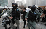 Policemen arrest a protester during a rally to show support for Uighurs and their fight for human rights in Hong Kong on December 22, 2019. (AP Photo/Lee Jin-man)