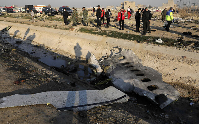 Debris is seen from the crashed Ukrainian as authorities work at the scene in Shahedshahr, southwest of Tehran, Iran, on January 8, 2020. (AP Photo/Ebrahim Noroozi)