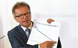 Austria's Health Minister Rudolf Anschober adresses the media during a press conference in Vienna, Austria, April 16, 2020. (Helmut Fohringer/APA via AP, Pool)