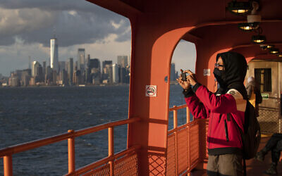 Illustrative: Kahari Boyd rides the Staten Island Ferry, Tuesday, April 21, 2020, in New York. (AP Photo/Mark Lennihan)