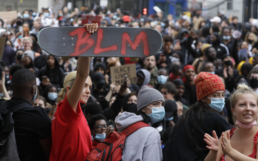 Illustrative: A protester holds up a skateboard with the Black Lives Matter initials in London, Wednesday, June 3, 2020, during a demonstration over the death of George Floyd, a black man who died after being restrained by police in Minneapolis, Minnesota. (AP Photo/Kirsty Wigglesworth)