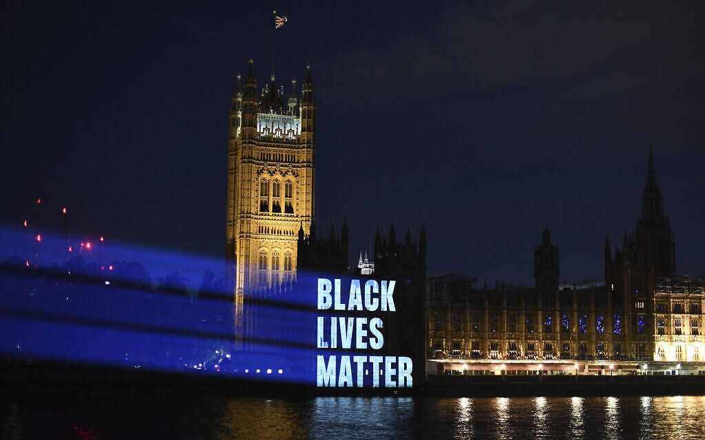 Black Lives Matter is projected onto the Houses of Parliament, in London, Friday, June 5, 2020, as part of the ongoing worldwide demonstrations following the death of George Floyd. (Victoria Jones/PA via AP)