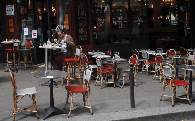 A man takes his lunch on a terrace at a restaurant, in Paris, June 15, 2020. (AP Photo/Francois Mori) A man takes his lunch on a terrace at a restaurant, in Paris, June 15, 2020. (AP Photo/Francois Mori)