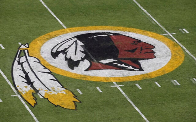 The Washington Redskins NFL football team logo is seen on the field before an NFL football preseason game against the New England Patriots in Landover, Maryland, August 7, 2014. (AP Photo/Alex Brandon, File) The Washington Redskins NFL football team logo is seen on the field before an NFL football preseason game against the New England Patriots in Landover, Maryland, August 7, 2014. (AP Photo/Alex Brandon, File)