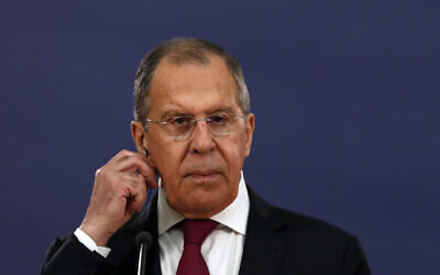 Russian Foreign Minister Sergey Lavrov listens as Serbia's President Aleksandar Vucic speaks during a joint press conference in Belgrade, Serbia, Thursday, June 18, 2020. (AP Photo/Darko Vojinovic)