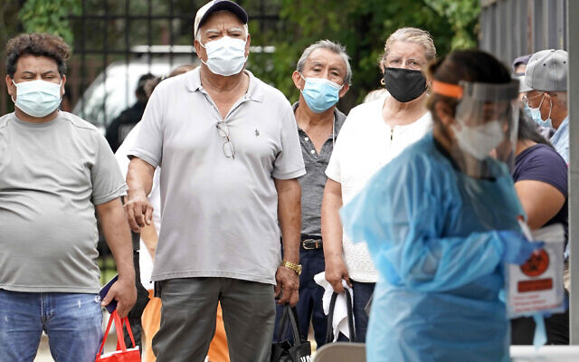 People wait in line at a free COVID-19 testing site provided by United Memorial Medical Center, at the Mexican Consulate on June 28, 2020, in Houston. (AP Photo/David J. Phillip) People wait in line at a free COVID-19 testing site provided by United Memorial Medical Center, at the Mexican Consulate on June 28, 2020, in Houston. (AP Photo/David J. Phillip)