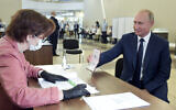 Russian President Vladimir Putin arrives to take part in voting at a polling station in Moscow, Russia on July 1, 2020. (Alexei Druzhinin, Sputnik, Kremlin Pool Photo via AP)