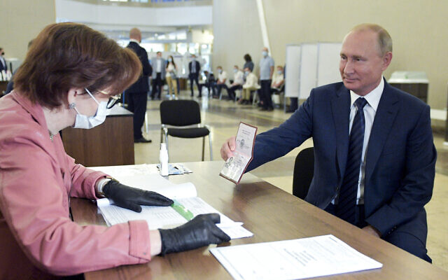 Russian President Vladimir Putin arrives to take part in voting at a polling station in Moscow, Russia on July 1, 2020. (Alexei Druzhinin, Sputnik, Kremlin Pool Photo via AP)