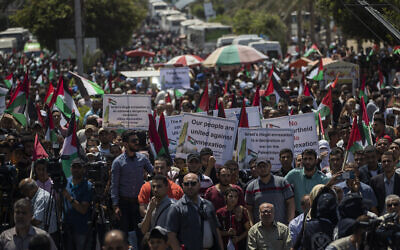 Palestinians demonstrate against Israeli plans for the annexation of parts of the West Bank, in Gaza City, Wednesday, July 1, 2020. (AP Photo/Khalil Hamra)