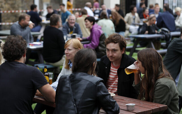 People enjoy their drinks at The Black Lion pub in London on July 4, 2020 (AP /Frank Augstein) People enjoy their drinks at The Black Lion pub in London on July 4, 2020 (AP /Frank Augstein)