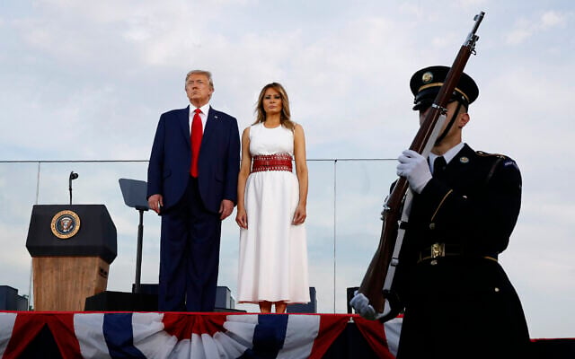 US President Donald Trump and first lady Melania Trump stand onstage during a "Salute to America" event on the South Lawn of the White House, Saturday, July 4, 2020, in Washington. (AP/Patrick Semansky) US President Donald Trump and first lady Melania Trump stand onstage during a "Salute to America" event on the South Lawn of the White House, Saturday, July 4, 2020, in Washington. (AP/Patrick Semansky)