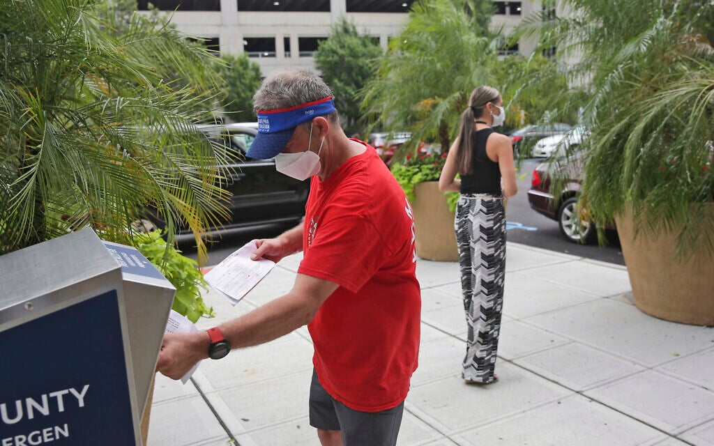 Illustrative: Richard Lynch drops his mail-in ballot into a drop box in Hackensack, N.J., Tuesday, July 7, 2020. (AP Photo/Seth Wenig) Illustrative: Richard Lynch drops his mail-in ballot into a drop box in Hackensack, N.J., Tuesday, July 7, 2020. (AP Photo/Seth Wenig)