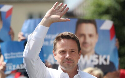 Contender in Poland's key presidential election runoff Sunday, liberal Warsaw Mayor Rafal Trzaskowski greets supporters during a campaign rally, in Raciaz, Poland, on July 9, 2020 (AP Photo/Czarek Sokolowski)