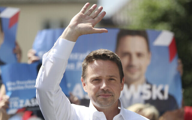 Contender in Poland's key presidential election runoff Sunday, liberal Warsaw Mayor Rafal Trzaskowski greets supporters during a campaign rally, in Raciaz, Poland, on July 9, 2020 (AP Photo/Czarek Sokolowski) Contender in Poland's key presidential election runoff Sunday, liberal Warsaw Mayor Rafal Trzaskowski greets supporters during a campaign rally, in Raciaz, Poland, on July 9, 2020 (AP Photo/Czarek Sokolowski)
