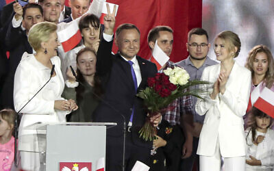 Incumbent President Andrzej Duda flashes a victory sign in Pultusk, Poland, on July 12, 2020. (AP Photo/Czarek Sokolowski)