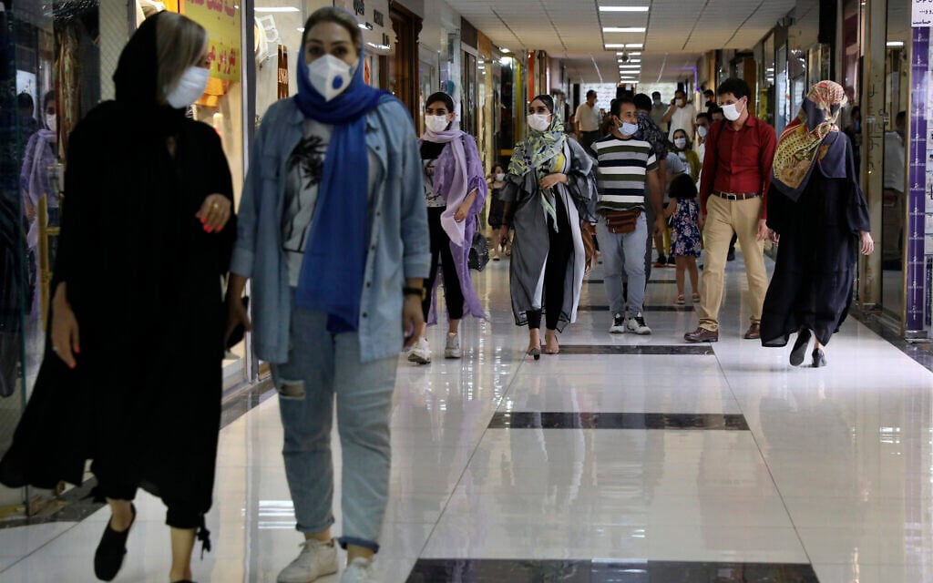 People wearing protective face masks to help prevent the spread of the coronavirus walk through the Nasr Shopping Center in Tehran, Iran, July 15, 2020 (AP Photo/Vahid Salemi) People wearing protective face masks to help prevent the spread of the coronavirus walk through the Nasr Shopping Center in Tehran, Iran, July 15, 2020 (AP Photo/Vahid Salemi)