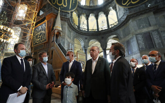Turkey's President Recep Tayyip Erdogan, center, and other officials visit the Byzantine-era Hagia Sophia, one of Istanbul's main tourist attractions in the historic Sultanahmet district of Istanbul, July 19, 2020, days after he formally reconverted Hagia Sophia into a mosque and declared it open for Muslim worship, after a high court annulled a 1934 decision that had made the religious landmark a museum.(Turkish Presidency via AP, Pool) Turkey's President Recep Tayyip Erdogan, center, and other officials visit the Byzantine-era Hagia Sophia, one of Istanbul's main tourist attractions in the historic Sultanahmet district of Istanbul, July 19, 2020, days after he formally reconverted Hagia Sophia into a mosque and declared it open for Muslim worship, after a high court annulled a 1934 decision that had made the religious landmark a museum.(Turkish Presidency via AP, Pool)