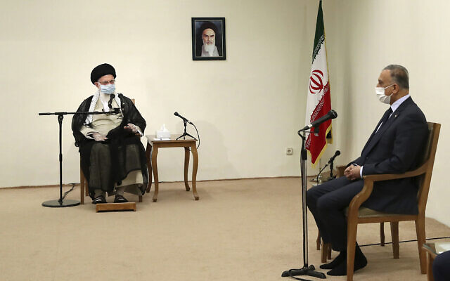 Iranian Supreme Leader Ayatollah Ali Khamenei, left, speaks with Iraqi Prime Minister Mustafa al-Kadhimi as they wear protective face masks to help prevent spread of the coronavirus, during their meeting in Tehran, Iran, July 21, 2020. (Office of the Iranian Supreme Leader via AP) Iranian Supreme Leader Ayatollah Ali Khamenei, left, speaks with Iraqi Prime Minister Mustafa al-Kadhimi as they wear protective face masks to help prevent spread of the coronavirus, during their meeting in Tehran, Iran, July 21, 2020. (Office of the Iranian Supreme Leader via AP)