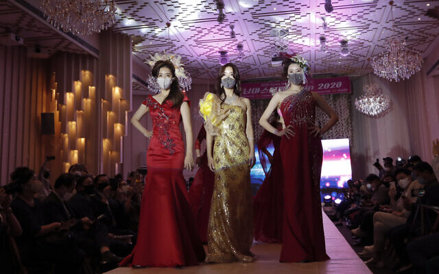 Models wearing face masks pose during a mask fashion show in Seoul, South Korea, Friday, July 24, 2020. (AP Photo/Lee Jin-man) Models wearing face masks pose during a mask fashion show in Seoul, South Korea, Friday, July 24, 2020. (AP Photo/Lee Jin-man)