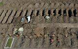 Wooden crosses mark freshly dug graves at the Flores cemetery where people who died from the coronavirus are being buried, in Buenos Aires, Argentina, July 25, 2020. (Gustavo Garello/AP)