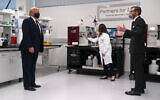 Fujifilm Diosynth Biotechnologies CEO Martin Meeson, right, speaks as President Donald Trump wears a face mask as he participates in a tour of Bioprocess Innovation Center at Fujifilm Diosynth Biotechnologies, Monday, July 27, 2020, in Morrisville, N.C. (AP Photo/Evan Vucci)