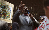 Minister Rodney Muhammad speaks to the crowd during a rally, outside the federal courthouse in Philadelphia, July 20, 2013. (Joseph Kaczmarek/AP)