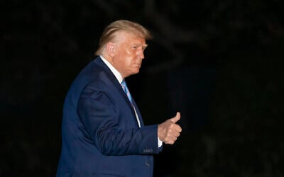 President Donald Trump gives a thumbs-up as he walks from Marine One as he returns to the White House from Texas, July 29, 2020, in Washington. (AP Photo/Alex Brandon)