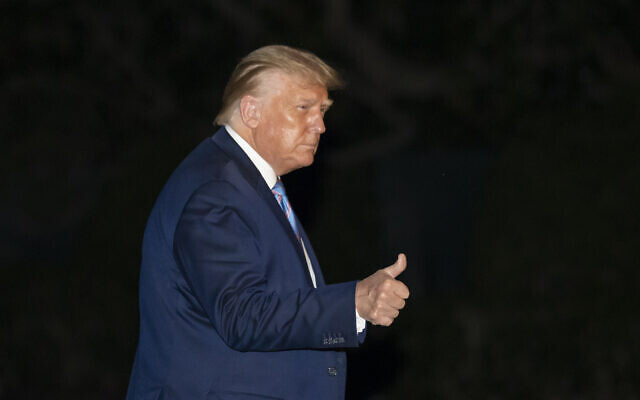 President Donald Trump gives a thumbs-up as he walks from Marine One as he returns to the White House from Texas, July 29, 2020, in Washington. (AP Photo/Alex Brandon) President Donald Trump gives a thumbs-up as he walks from Marine One as he returns to the White House from Texas, July 29, 2020, in Washington. (AP Photo/Alex Brandon)