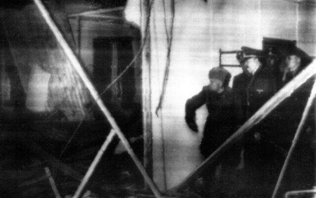The file photo from July 1944 shows Hitler and Mussolini surveying the damage inside Hitler's Wolf's Lair (Wolfschanze) headquarters in East Prussia following an assassination attempt of high-ranking officers of the Wehrmacht against Hitler on July 20, 1944. A briefcase containing a bomb was placed by Colonel Claus Schenk Graf von Stauffenberg under the table with maps where Hitler was confering with his staff officers. He was only slightly hurt. (AP Photo)