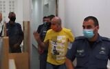 Screen capture from video of David Chaim, center, arrives at the Central District Court for the verdict in his trial for the murder of his ex-wife, Ofira, July 12, 2020. (Ynet)