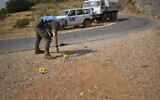 UNIFIL soldiers inspect an impact site caused by IDF munitions during a failed attack on the border from Lebanon, on July 29, 2020. (UNIFIL)