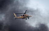 Illustrative: An Israeli Apache helicopter flies during an aerial show at a graduation ceremony for soldiers who have completed the IAF Flight Course, at the Hatzerim Air Base in the Negev desert, December 29, 2016.(Miriam Alster/Flash90)