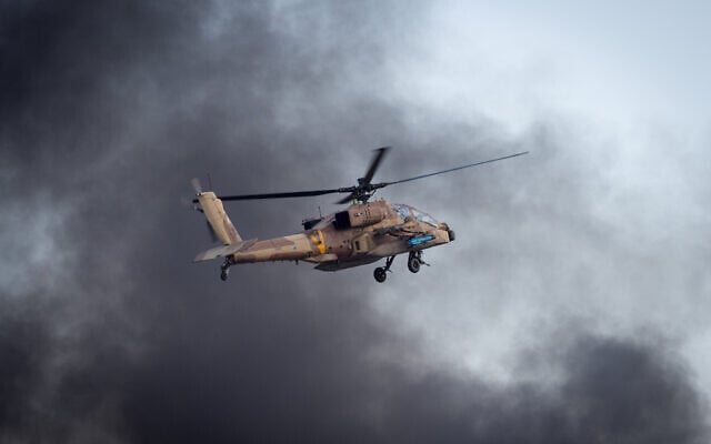 Illustrative: An Israeli Apache helicopter flies during an aerial show at a graduation ceremony for soldiers who have completed the IAF Flight Course, at the Hatzerim Air Base in the Negev desert, December 29, 2016.(Miriam Alster/Flash90) Illustrative: An Israeli Apache helicopter flies during an aerial show at a graduation ceremony for soldiers who have completed the IAF Flight Course, at the Hatzerim Air Base in the Negev desert, December 29, 2016.(Miriam Alster/Flash90)