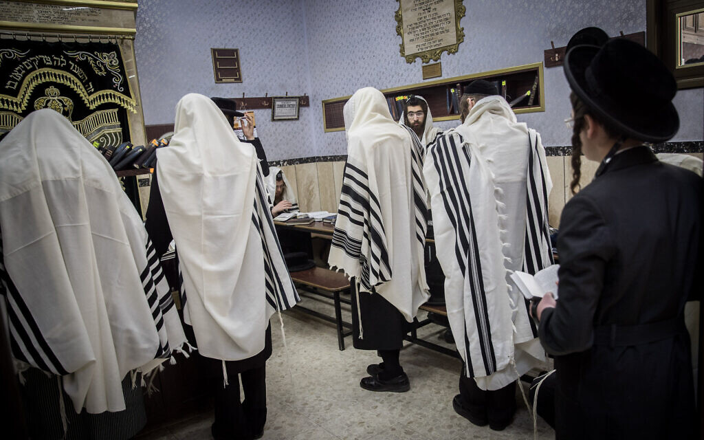 Ultra-Orthodox men pray at a synagogue in the neighborhood of Mea Shearim, Jerusalem, on May 20, 2020 (Yonatan Sindel/Flash90) Ultra-Orthodox men pray at a synagogue in the neighborhood of Mea Shearim, Jerusalem, on May 20, 2020 (Yonatan Sindel/Flash90)